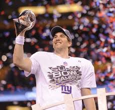 Eli Manning Holds the LombardiTrophy