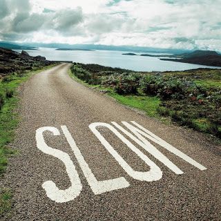 A Slow sign on a Road
